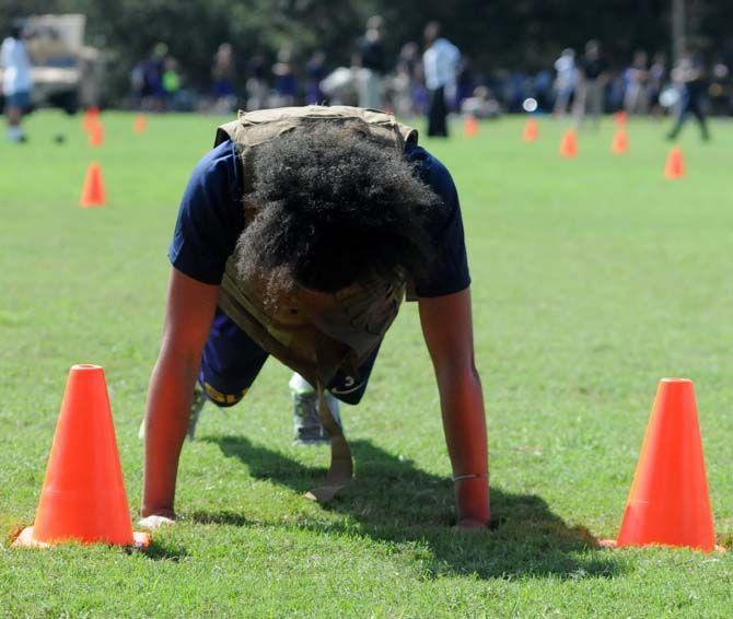 LSU women's basketball junior guard Daniellie Ballard performs push ups during practice with the marines September 19, 2014.