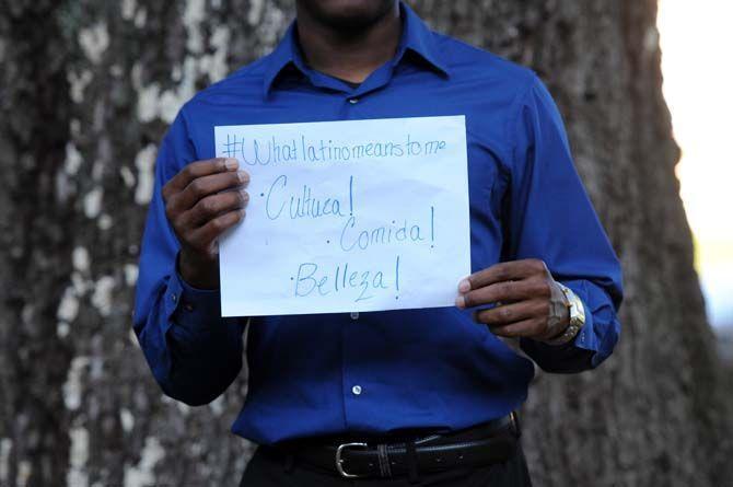 The Hispanic Student Cultural Society make signs about what being Latino means to them.