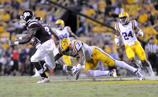 LSU freshman safety Jamal Adams (33) tackles Mississippi State freshman wide receiver Jamoral Graham (81) during the game where LSU lost 34-29 in Tiger Stadium Saturday September 20, 2014.