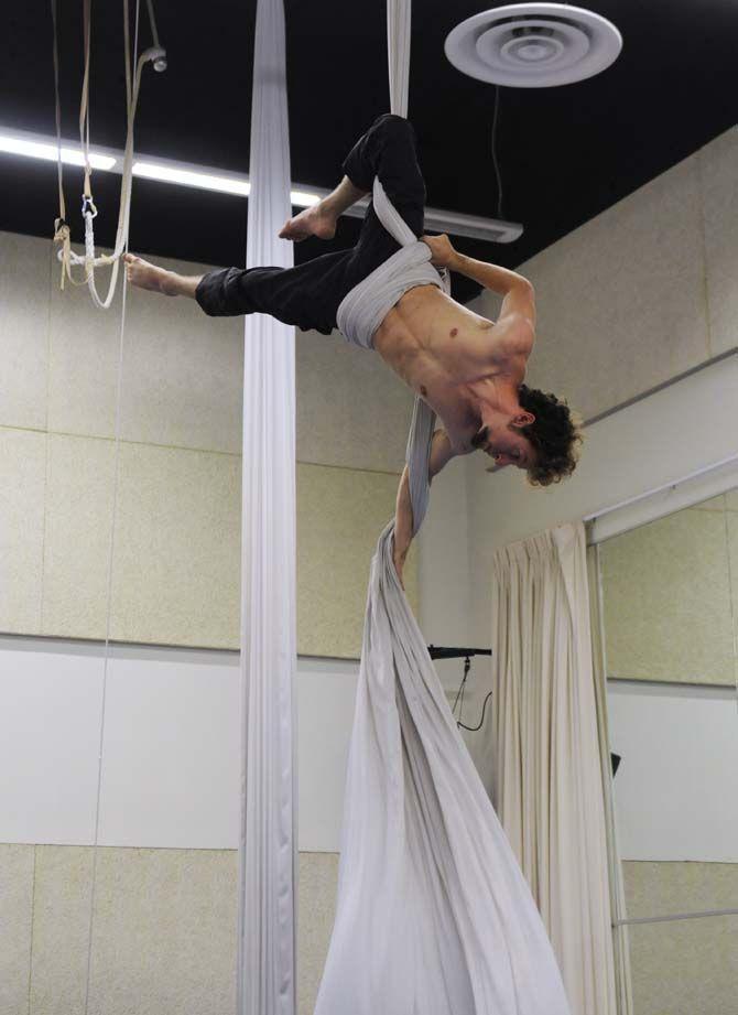 Teaching assistant and co-creator of ORIGIN Mark Gibson poses on aerial silk.