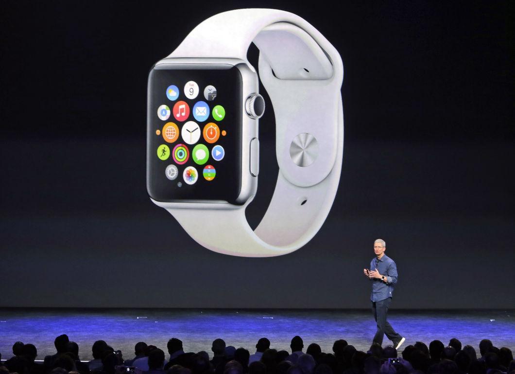 Apple CEO Tim Cook introduces the new Apple Watch on Tuesday, Sept. 9, 2014, in Cupertino, Calif. Apple's new wearable device marks the company's first major entry in a new product category since the iPad's debut in 2010. (AP Photo/Marcio Jose Sanchez)