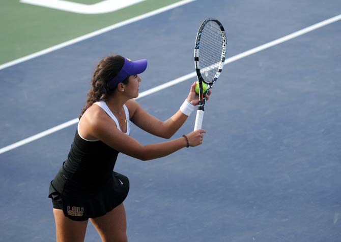 LSU freshman Joana Vale Costa serves the ball Friday, March 21, 2014 during a doubles match against Mississippi State at W.T. "Dub" Robinson Stadium.