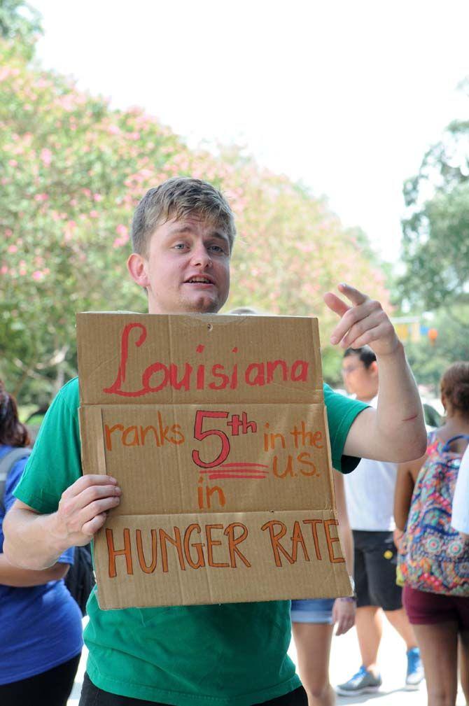 Economics senior Matthew Waldrop raises awareness about hunger for Kitchens on the Geaux at the Student Involvement Fair Wednesday, September 3, 2014.