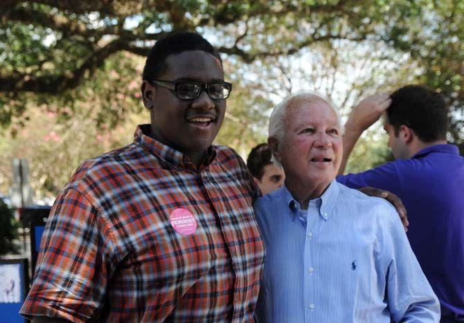 Edwin Edwards poses with a student at LSU's College Democrats table during the Student Involvement Fair Wednesday September 3, 2014.