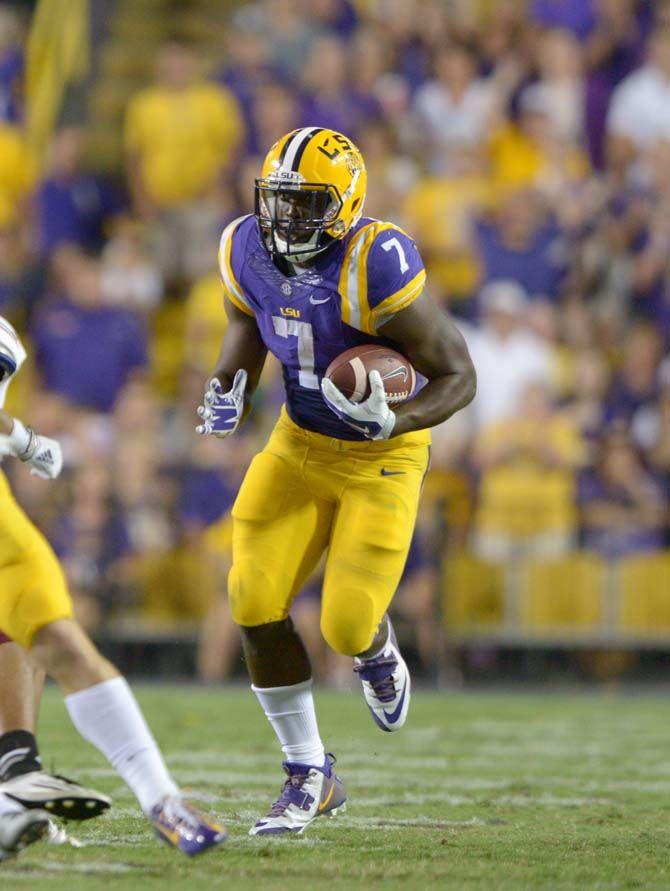 LSU freshman running back Leonard Fournette (7) runs down the field in Tiger Stadium Saturday, September 27, 2014 in winning game 63-7 against NMSU.