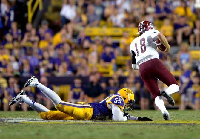LSU senior defensive end Jermauria Rasco misses tackle of NMSU player Saturday, September 27, 2014 during the Tigers' 63-7 victory against the Aggies in Tiger Stadium.