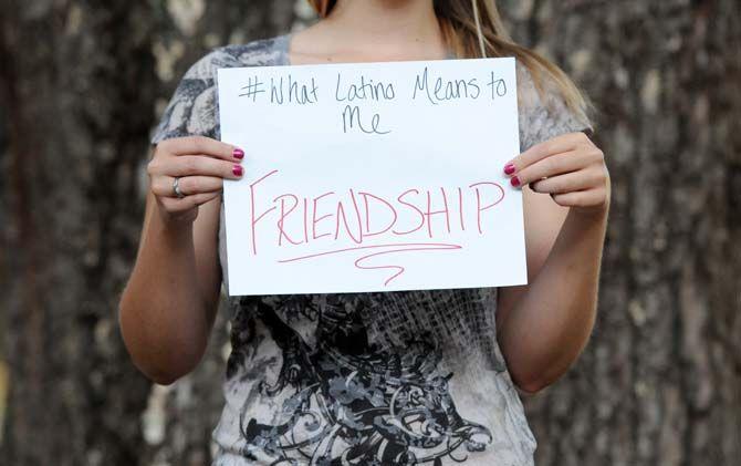 The Hispanic Student Cultural Society make signs about what being Latino means to them.