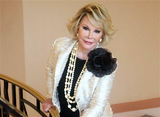 FILE - This Oct. 5, 2009 file photo shows Joan Rivers posing as she presents "Comedy Roast with Joan Rivers " during the 25th MIPCOM (International Film and Programme Market for TV, Video, Cable and Satellite) in Cannes, southeastern France. Rivers, the raucous, acid-tongued comedian who crashed the male-dominated realm of late-night talk shows and turned Hollywood red carpets into danger zones for badly dressed celebrities, died Thursday, Sept. 4, 2014. She was 81. Rivers was hospitalized Aug. 28, after going into cardiac arrest at a doctor's office. (AP Photo/Lionel Cironneau, File)