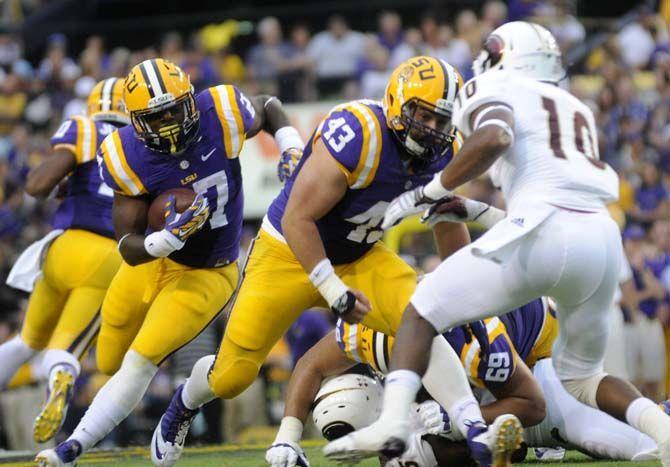 LSU senior running back Kenny Hilliard runs the ball down the field Saturday, Sep. 13, 2014 during the Tigers' 31-0 victory against ULM in Tiger Stadium.