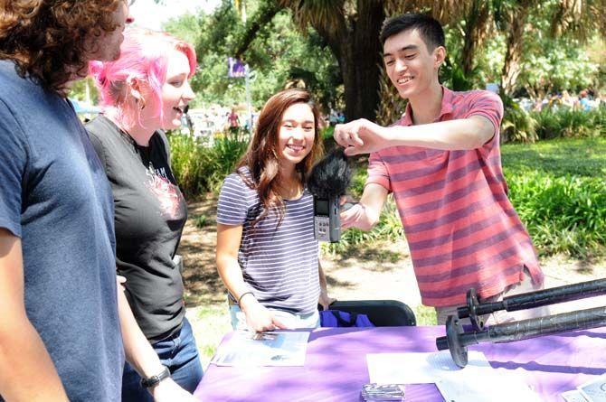 Film Club president Sean Tessier shows film equipment to students at the Student Involvement Fair on Wednesday, September 3, 2014.