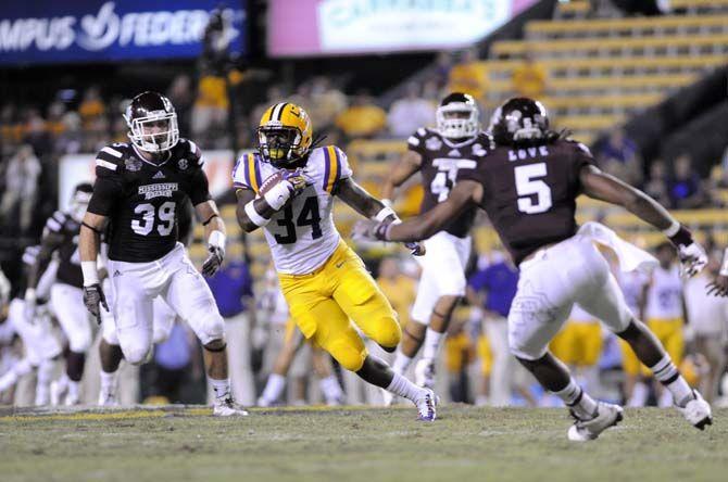 LSU junior defensive back Jordan Triche (34) takes the ball down the field in Tiger Stadium Saturday, September 20, 2014 in a game against Mississippi State.