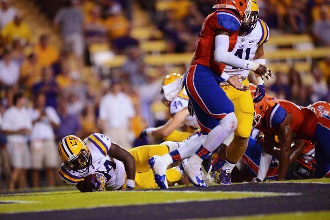 LSU freshman running back Darrel Williams (34) falls into the endzone for a touchdown Saturday, September 6, 2014 during the Tigers' 56-0 win against Sam Houston State in Tiger Stadium.
