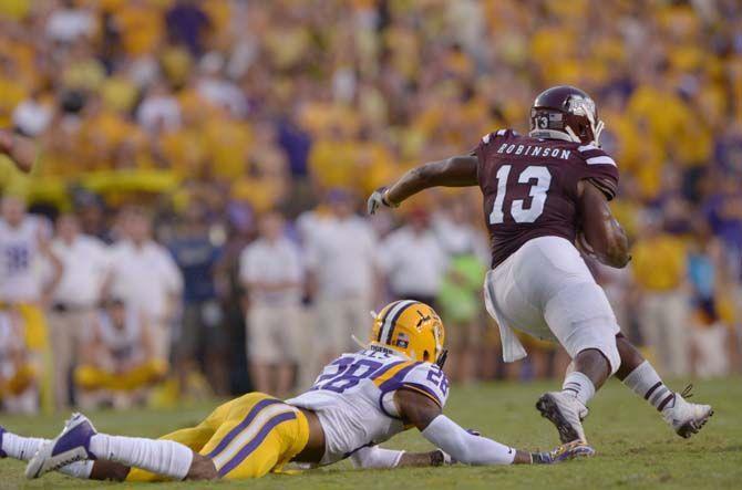 LSU junior safetey Jalen Mills (28) watches opponent drive the ball down the field in Tiger Stadium Saturday, September 20, 2014 in Tigers' defeat 34-29 against Mississippi State University.