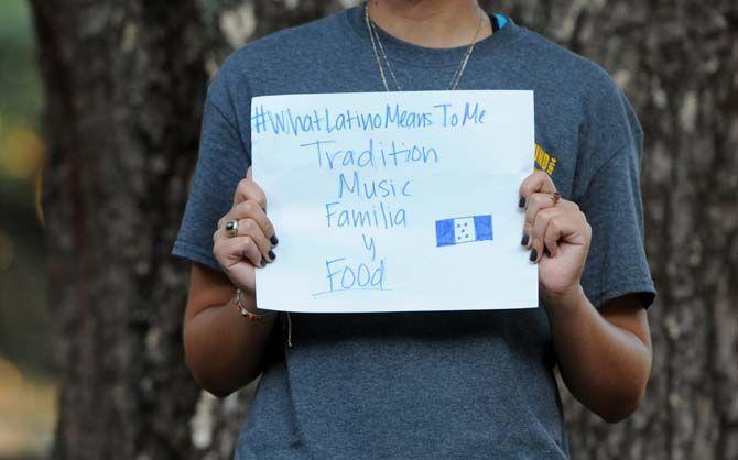 The Hispanic Student Cultural Society make signs about what being Latino means to them.