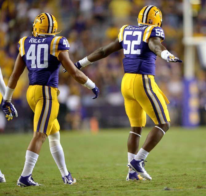 Sophomore linebacker Kendell Beckwith (52) celebrates a defensive stand during the Tigers' 31-0 victory against ULM on Saturday, September 13th, 2014.