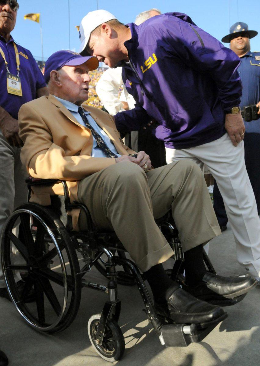 LSU football head coach Les Miles speaks with former LSU and NFL quarterback Yelberton Abraham Tittle on Saturday September 20, 2014 before the game against Mississippi where LSU lost 34-29 in Tiger Stadium.