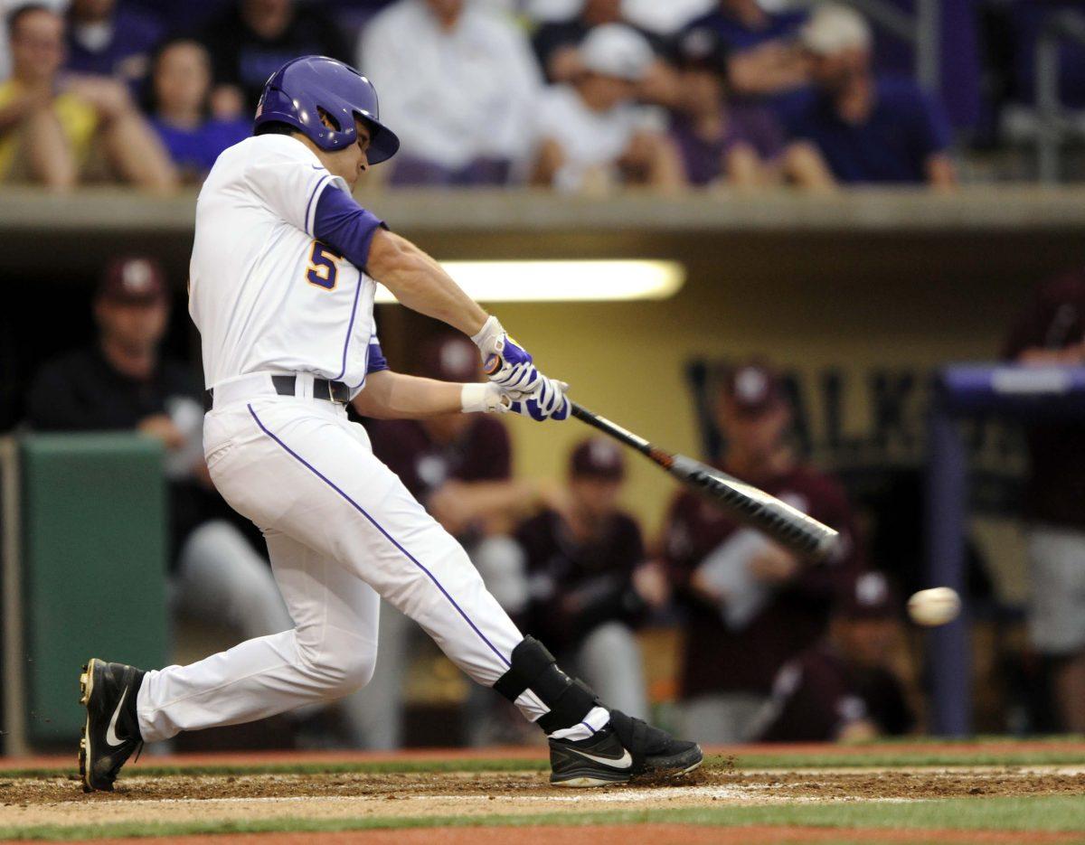 LSU junior Chris Sciambra (5) hits the ball during the Tigers' 3-0 victory against Mississippi State on Friday, April 4, 2014 at Alex Box Stadium.