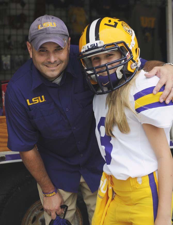 Fans pose in their gameday outfits Saturday, September 13, 2014 before the LSU vs ULM football game in Tiger Stadium.