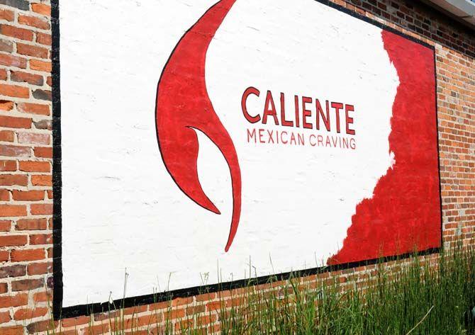Caliente Mexican Craving on W. Lee Drive is one of a small number of businesses to keep up the old tradition of hand painting signs.