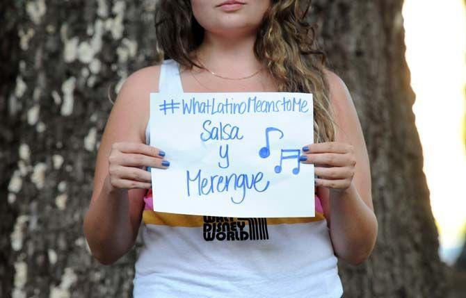 The Hispanic Student Cultural Society make signs about what being Latino means to them.