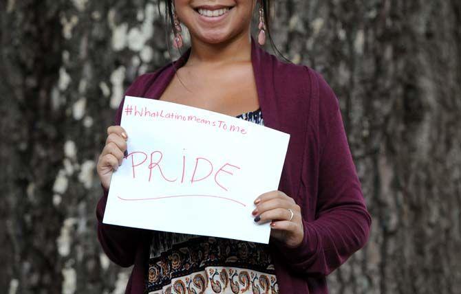 The Hispanic Student Cultural Society make signs about what being Latino means to them.