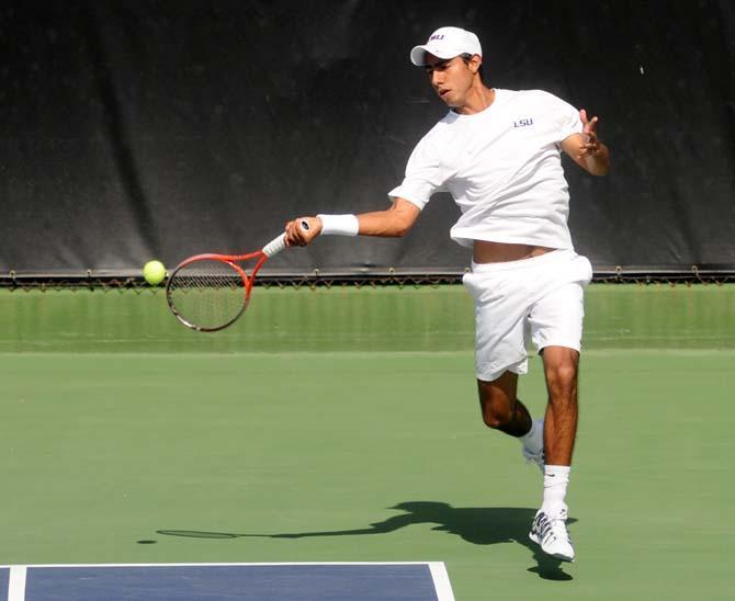 LSU sophomore tennis player Boris Arias prepares to hit the ball Sunday, Feb. 9, 2014 during the Tigers' 6-1 victory against Southern Miss in W.T. "Dub" Robinson Tennis Stadium.