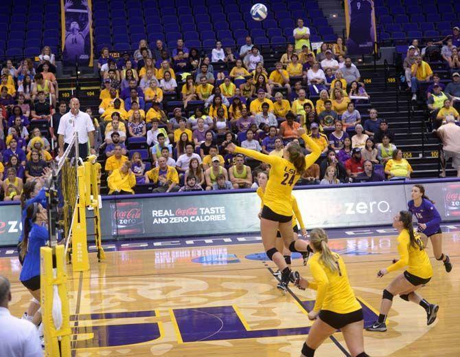 LSU junior outside hitter/right side Cati Leak (21) jumps to hit the ball during the loss aginst Kentucky Wednesday, September 24, 2014 in the PMAC