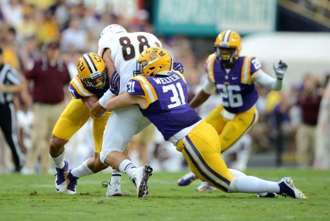 LSU senior linebacker D.J. Welter (31) brings down a ULM ball carrier Saturday, Sep. 13, 2014 during the Tigers' 31-0 victory against the Warhawks in Tiger Stadium.