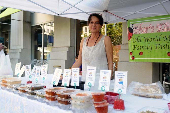 Nur Pinner of Nur's Kitchen provides a selection of Mediterranean foods at the Red Stick Farmer's Market located on Main Street.