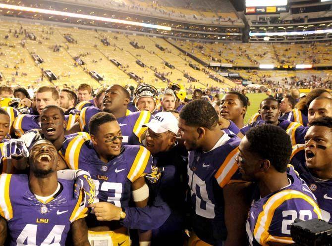 LSU head coach Les Miles and the Tigers celebrate their 31-0 victory against ULM on Saturday, September 13th, 2014.