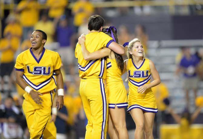 Members of the LSU cheerleading squad celebrate a play on the sidelines in a game against Mississippi State in Tiger Stadium Saturday, September 20, 2014.