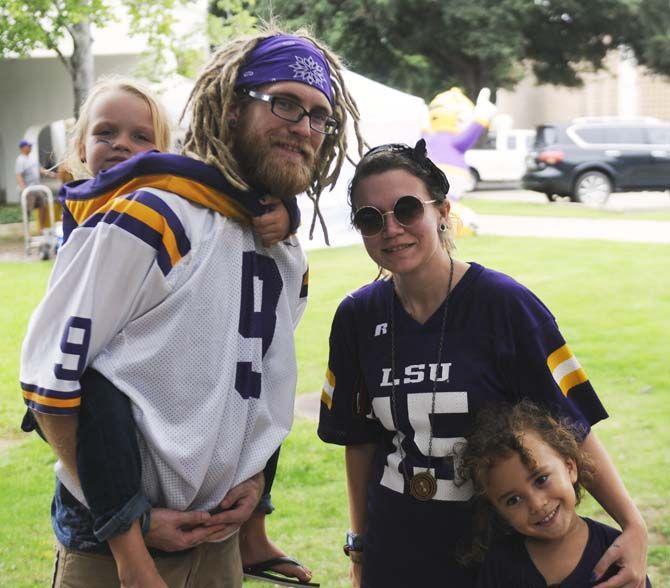 Fans pose in their gameday outfits Saturday, September 13, 2014 before the LSU vs ULM football game in Tiger Stadium.