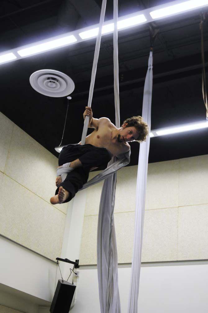 Teaching assistant and co-creator of ORIGIN Mark Gibson poses on aerial silk.