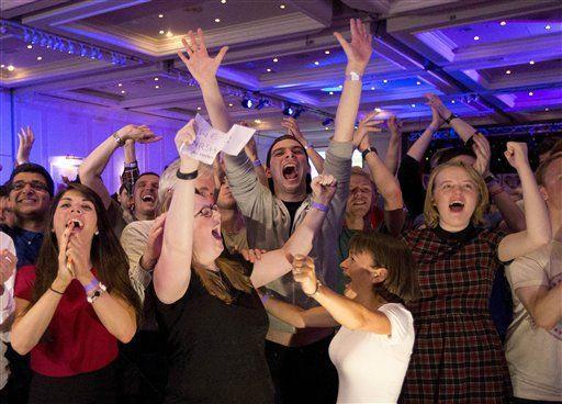 No supporters for the Scottish independence referendum celebrate a result at a No campaign event at a hotel in Glasgow, Scotland, early Friday, Sept. 19, 2014. From the capital of Edinburgh to the far-flung Shetland Islands, Scots embraced a historic moment &#219; and the rest of the United Kingdom held its breath &#219; after voters turned out in unprecedented numbers for an independence referendum that could end the country's 307-year union with England. (AP Photo/Matt Dunham)