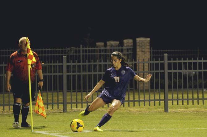 LSU junior midfielder Natalia Gomez-Junco (11) trhows a corner kick Friday, August 29, 2014 during the Tigers' victory 6-2 against Northwestern St. in LSU Soccer Stadium.