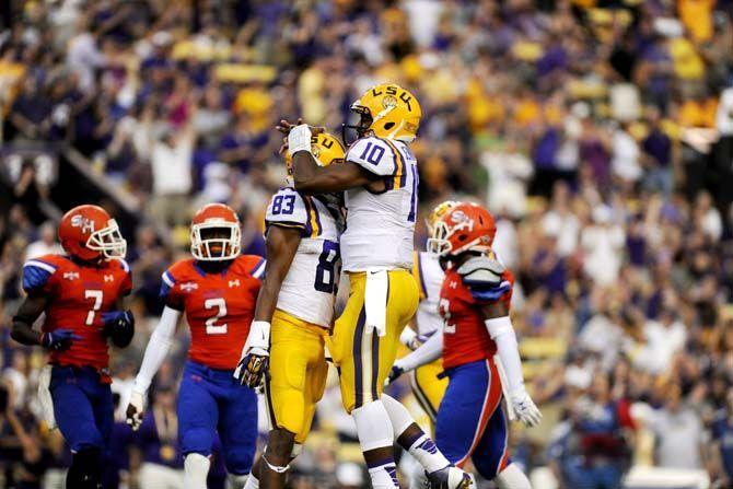 LSU sophomore wide receiver Travin Dural (83) and sophomore quarterback Anthony Jennings celebrate a touchdown Saturday, September 6, 2014 during the Tigers' 56-0 win against Sam Houston State in Tiger Stadium.