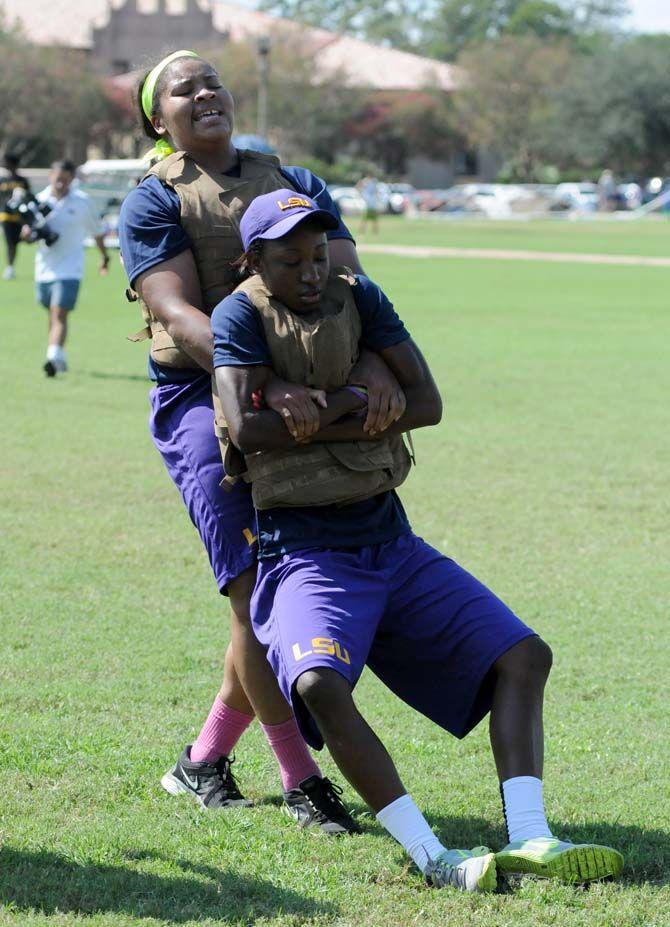 LSU women's basketball junior forward Alexis Hyder drags freshman forward Stephanie Amichia during practice with the marines Friday September 19, 2014.