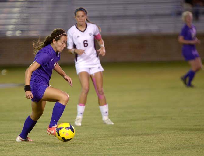 LSU junior midfielder Fernanda Pina (7) runs the ball Friday at LSU soccer stadium where LSU lost to Texas A&amp;M 4-1.