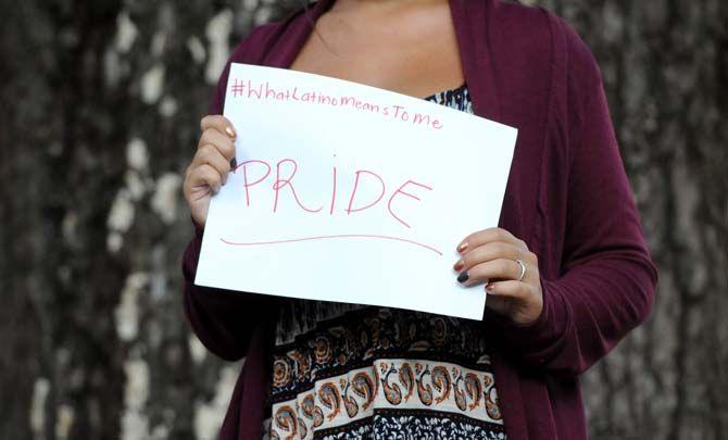 The Hispanic Student Cultural Society make signs about what being Latino means to them.