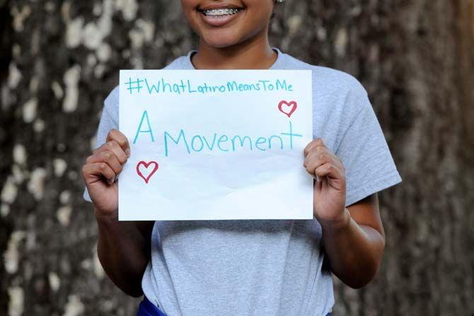 The Hispanic Student Cultural Society make signs about what being Latino means to them.