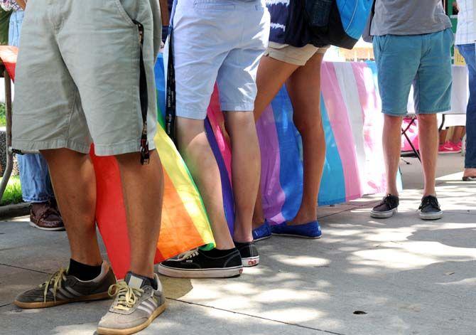 Students line up in front of the Spectrum table in front of the Union at the Student Involvement Fair Wednesday, September 3, 2014.