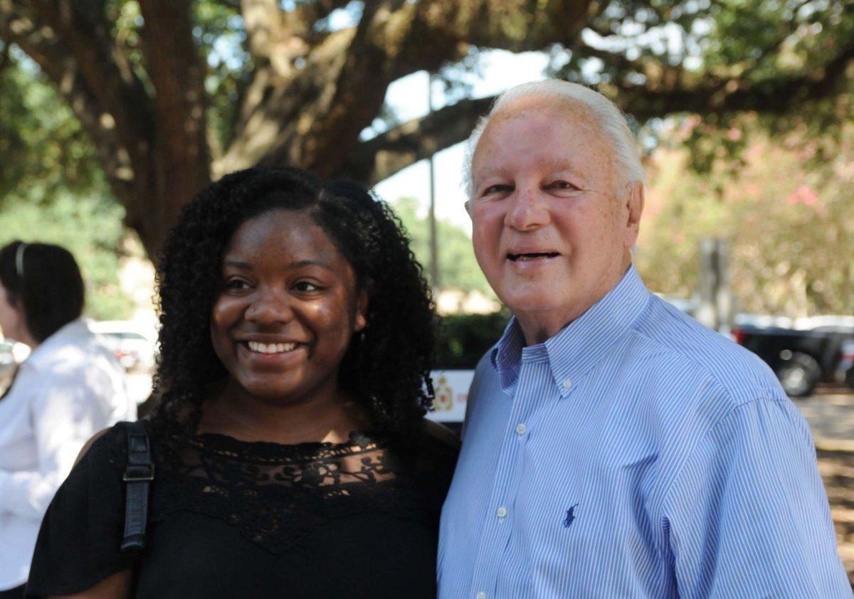 Edwin Edwards poses with a student at LSU's College Democrats table during the Student Involvement Fair Wednesday September 3, 2014.