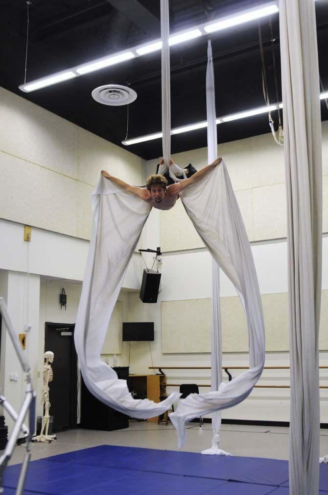 Teaching assistant and co-creator of ORIGIN Mark Gibson creates a bird-like effect using aerial silk.