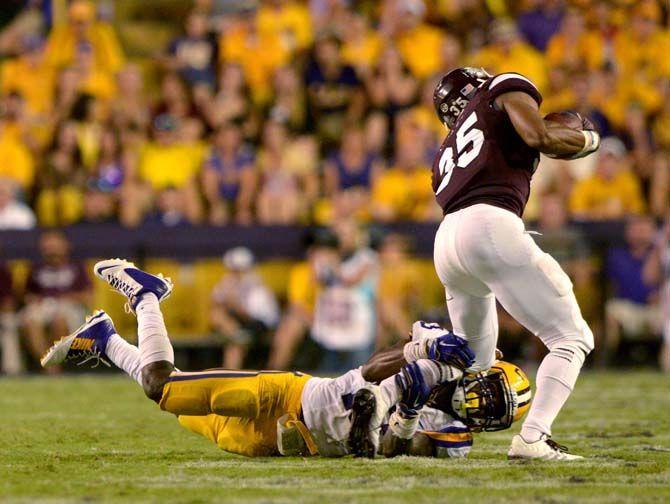 LSU sophmore cornerback Dwayne Thomas (13) tackles Mississippi State Freshmam wide receiver Gabe Myles (35) in Tiger Stadium where LSU lost 34-29 Saturday September 20, 2014.