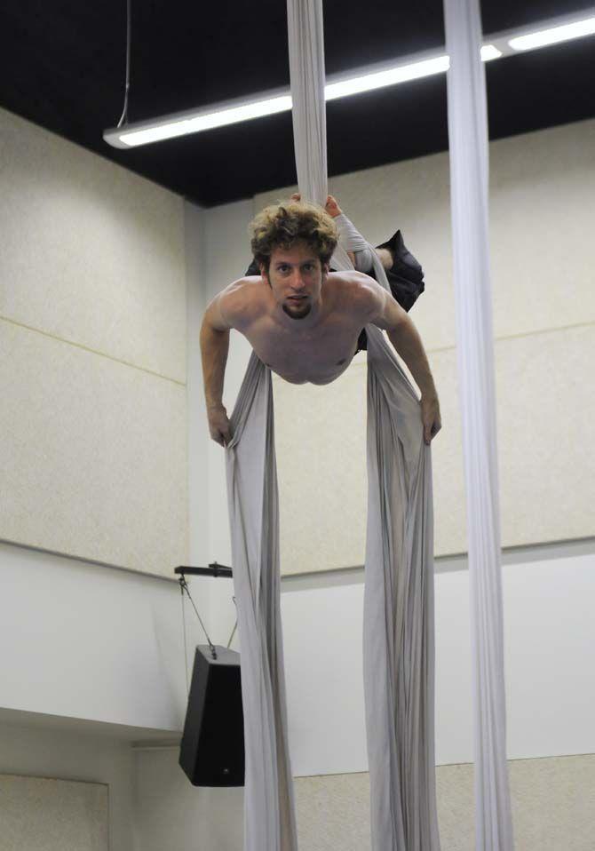 Teaching assistant and co-creator of ORIGIN Mark Gibson poses on aerial silk.