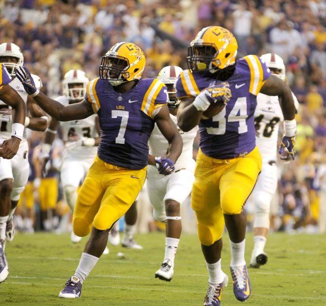 Freshman running back Darrel Williams (34) runs for a touchdown in the Tigers' 31-0 victory against ULM.