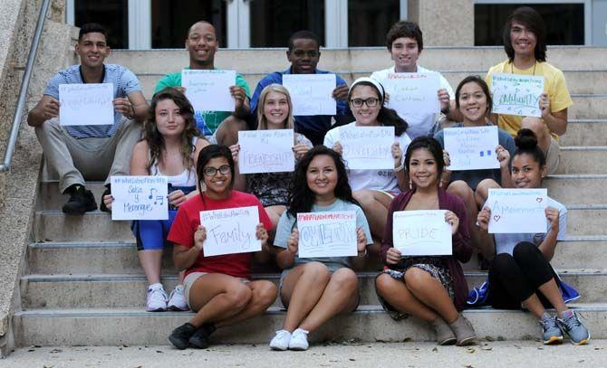 The Hispanic Student Cultural Society make signs about what being Latino means to them.