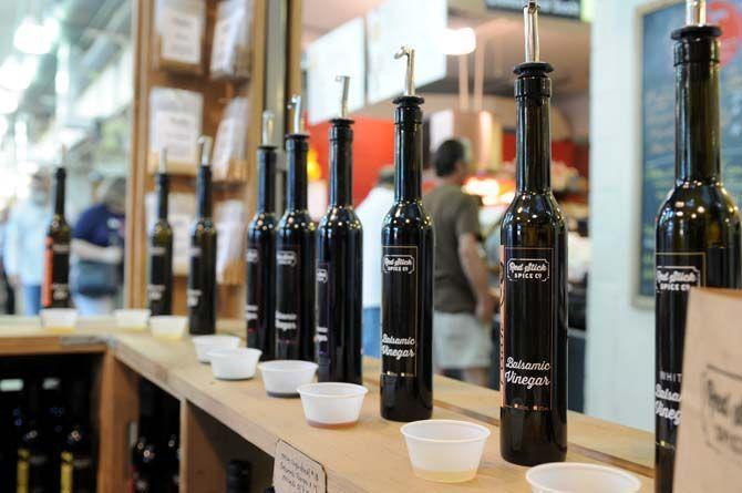 A variety of vinegar blends sit displayed at Red Stick Spice Company's Main Street location Saturday, September 6, 2014.