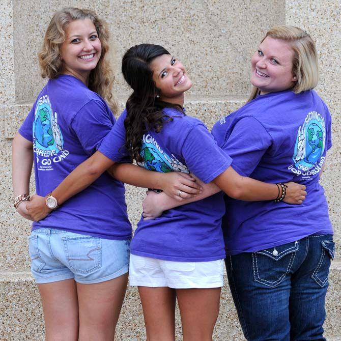 LSU early childhood education junior Lindsey Baker (left), communication disorder senior Lauren Ortego (middle), and communication studies senior Sam Sherwood pose for the Deaf and Hard of Hearing Club.