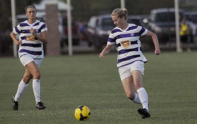 LSU sophomore defender Megan Lee (13) dribbles the ball ahead of sophomore defender Gracie Campbell (23) Sunday, August 31, 2014 during the Tigers' 0-1 defeat against in LSU Soccer Stadium.